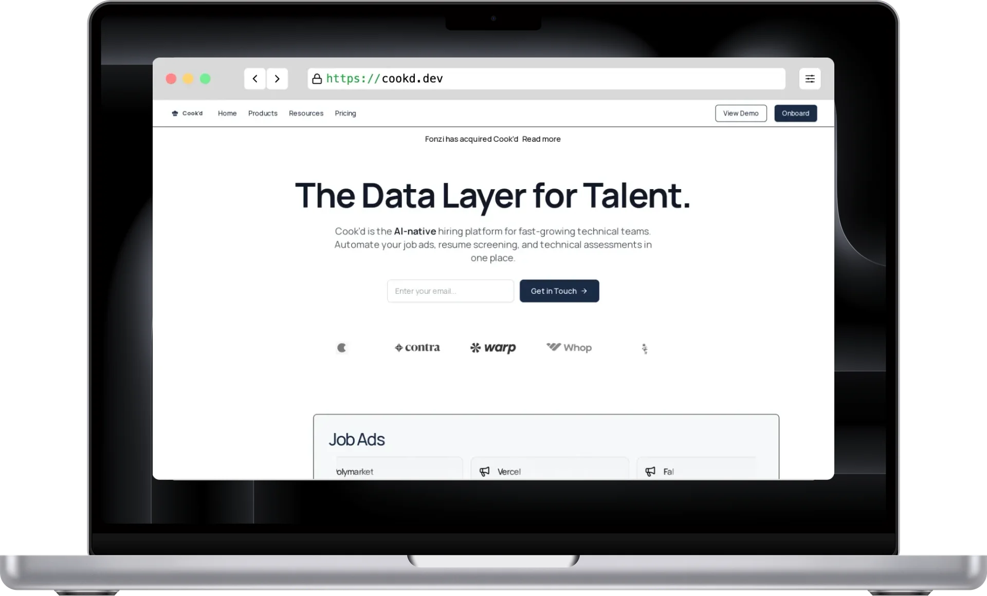 Cook`d landing page on a MacBook
